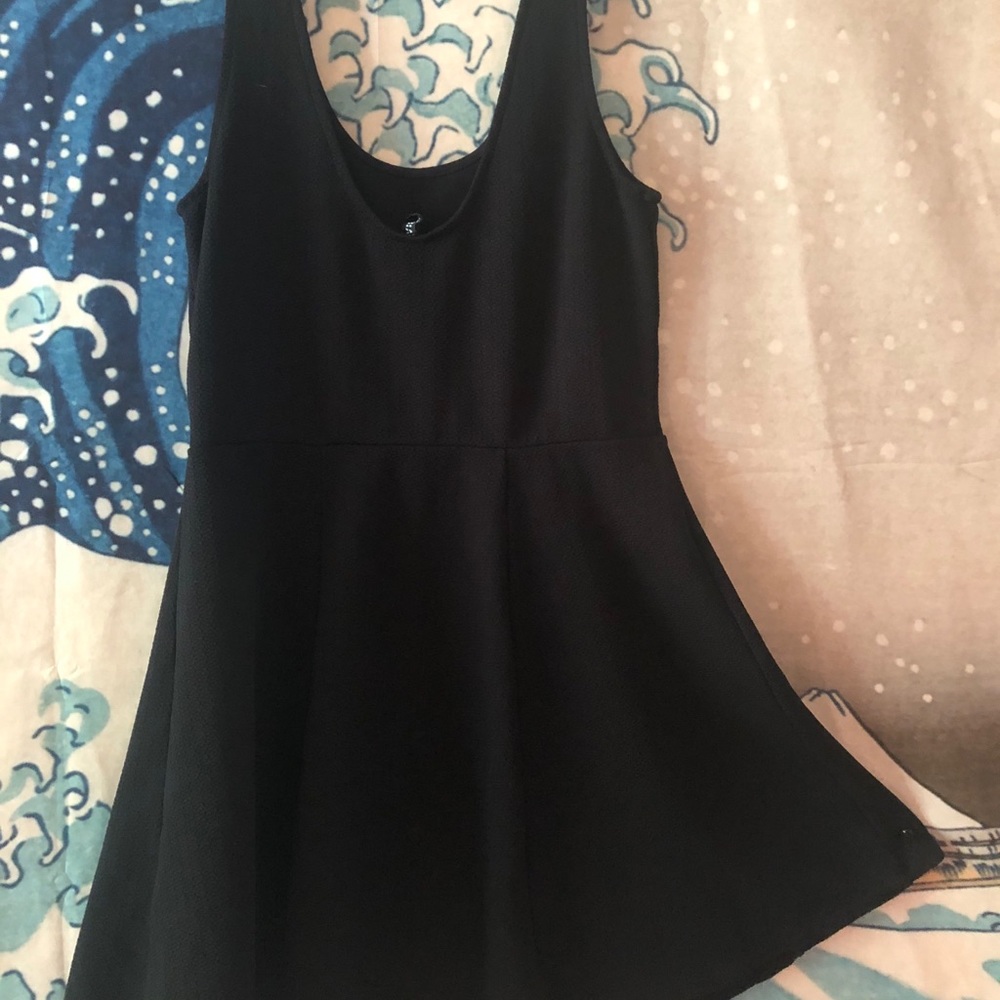 Tight, pleated black dress